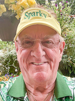 Sparky Taft in green shirt, yellow visor